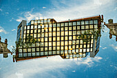Double exposure of a modernist glass and steel building in Marseille, France.