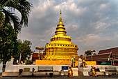 The golden chedi of the Buddhist temple Wat Phra That Si in Chom Thong, Thailand, Asia