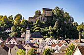  City view with the parish church of St. Bartholomew and the castle in Pottenstein in Franconian Switzerland, Bavaria, Germany   