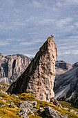 Climbers on the Pieralongia in the Puez-Geissler Nature Park in autumn, Val Gardena, Bolzano, South Tyrol, Italy