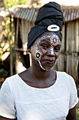  Woman with decorative face paint from Masonjoany, Nosy Komba, Diana, Madagascar, Indian Ocean 