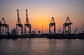  Cargo cranes in Jeddah port at sunset, Jeddah, Saudi Arabia, Middle East 