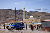  People and police car in a village with a mosque, near Arta, Djibouti, Middle East 