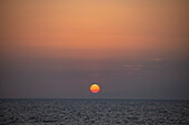  Sunset in the Bab-el-Mandeb Strait between the Arabian Peninsula and Djibouti, at sea, near Yemen, Middle East 