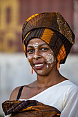  Happy woman with decorative face painting from Masonjoany, Mahajanga, Boeny, Madagascar, Indian Ocean 