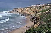  Atlantic coast, 2 people on the beach south of Ericeira, Portugal 