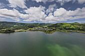  Aerial view of the small town of Sete Cidades on the crater lake Lagoa Azul on the island of Sao Miguel, Azores. 