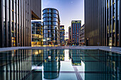  Modern high-rise architecture at the Medienhafen district in Düsseldorf at dusk, North Rhine-Westphalia, Germany, Europe  