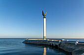 Sculpture of winged Mayan Angel on tall column, the seafront Malecon, Campeche city, Campeche State, Mexico