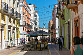 Restaurant tables in historic street of Spanish colonial buildings,  Campeche city, Campeche State, Mexico