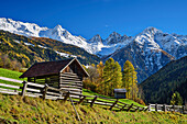  Two barns in autumnal Kaunertal with Kleiner Dristkogel, Grosser Dristkogel and Brehnspitze, Kaunertal, Ötztal Alps, Tyrol, Austria 