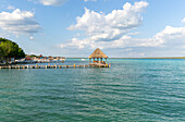 Cabana thatched cabin on wooden jetty Lake Bacalar, Bacalar, Quintana Roo, Yucatan Peninsula, Mexico