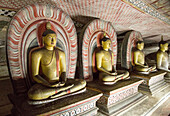 Buddha figures inside Dambulla cave Buddhist temple complex, Sri Lanka, Asia