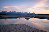  Pool of water in the dry Forggensee at sunset, Bavaria, Germany, Europe 
