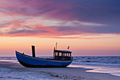 Fishing boat on the beach in the evening, Heringsdorf, Usedom Island, Mecklenburg-Western Pomerania, Germany 