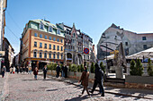  Locals and tourists stroll through the Old Town, Riga, Latvia 