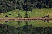  Haystacks at Geroldsee with reflection, Werdenfelsener Land, Upper Bavaria, Bavaria, Germany 