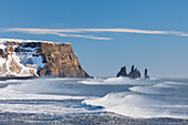  Basalt rock needles Reynisdrangar, Reynisfjara, winter, Iceland 