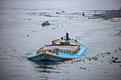  Fully loaded cargo ship on the Dakatiya River, Chandpur, Chandpur District, Bangladesh, Asia 