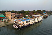  Aerial view of river cruise ship RV Thurgau Ganga Vilas (Thurgau Travel) moored on Dakatiya river at sunset, Chandpur, Chandpur District, Bangladesh, Asia 