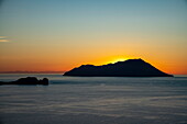  Silhouette of islands at sunset, Plaka, Milos, South Aegean, Greece, Europe 