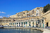 Historic waterfront buildings on Grand Harbour waterside, Valletta, Malta