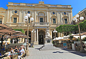 National Library building Queen Victoria statue and cafes in Republic Square, Valletta, Malta