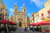Basilica church and cafes in Saint George's square, Plaza San Gorg,  Victoria Rabat, island of Gozo, Malta