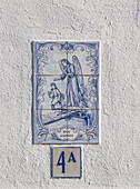 Azulejo tile ceramic image of guardian angel above house door, village of Alvito, Baixo Alentejo, Portugal, southern Europe