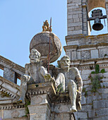 Church of Igreja de Nossa Senhora de Graca, Evora, Alto Alentejo, Portugal, southern Europe two stone Atlas-like figures sit on each corner nicknamed by locals the 'children of Grace'