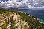  Franciscan monastery and church of Our Lady of the Angels and the coast seen from above, Orebic, Peljesac peninsula, Croatia, Europe  