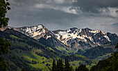  View of the Swiss Alps from the small village of Gruyeres in the canton of Fribourg, Switzerland 