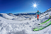  Woman on ski tour ascends through the Loigistal to the Pyhrner Kampl, Totes Gebirge, Upper Austria, Austria 