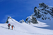  Two people on ski tour ascending to the Sattelspitze, Sattelspitze, Ahrntal, Rieserferner-Ahrn Nature Park, Zillertal Alps, South Tyrol, Italy 