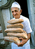  Baker with bread, ottaviano desi bakery 