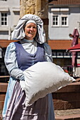  Woman in the costume of the character “Frau Holle” from the fairy tale “Frau Holle” by the Brothers Grimm, Steinau an der Straße, Spessart-Mainland, Hesse, Germany 