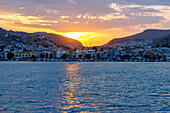  Sunset behind Póthia with town hall (Dimarchio) and boats in the harbor on the island of Kalymnos (Kalimnos) in Greece 