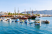  Fishing boats and excursion boats in the harbor in Kardamena on the island of Kos in Greece 