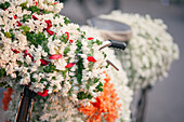 Pune, India, Flower vendor selling flowers on the bike. Jasmine flowers