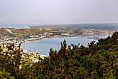  Bay of Kefalos (Kolpos Kefalou) overlooking Kamari, Kamari Beach and Kambnos with the island of Nisi Kastri with the chapel of Agios Nikolaos on the island of Kos in Greece 