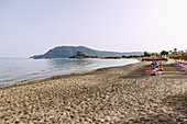  Agios Stefanos Beach overlooking the island of Kastri with the chapel of Agios Nikolaos and the bay of Kefalos on the island of Kos in Greece  