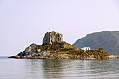  View of the island of Kastri with the chapel of Agios Nikolaos in the bay of Kefalos on the island of Kos in Greece 