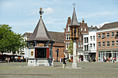 People walking over the Markt (market square); the famous central square in 's-Hertogenbosch' city centre.