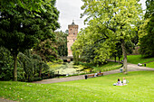 People chilling in the beautiful green Kronenburgpark in Nijmegen, the Netherlands, Europe.