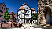  Chancellor Feige fountain, portal of the parish church, Holleum in the old town hall, market square in Hessisch Lichtenau, Hesse, Germany 