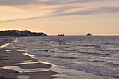  Sunset on the beach at the pier of Albeck with a view to Heringsdorf, Usedom Island, Mecklenburg-Western Pomerania, Germany 