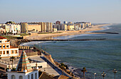 Coastal view east of sandy beaches and apartment housing, Cadiz, Spain