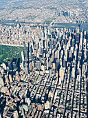 Aerial view of midtown Manhattan, Central Park and Upper East Side in foreground and Roosevelt Island, East River and Queens County in background, New York City, New York, USA