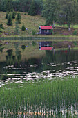  Wooden house by the lake, summer, Vaermland, Sweden 