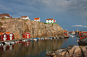  Colorful boathouses in Smoegen, archipelago, Bohuslaen, Sweden 